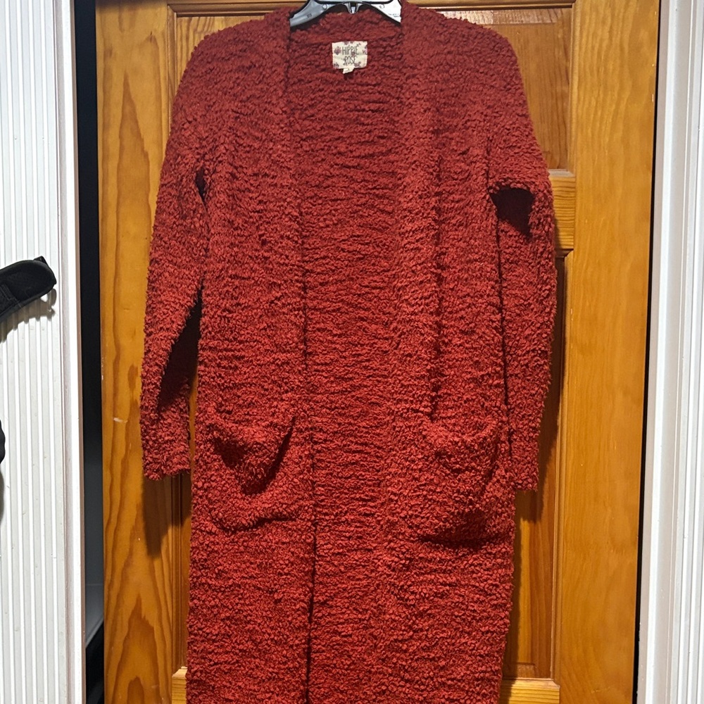 super soft fashionable rust colored open front sweater jacket.